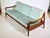 Danish Design teak sofa from the 1960s. Three-seater with a pull-out seat and removable cushions. Can be used as a daybed...