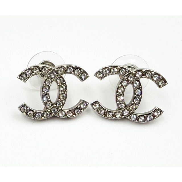 Chanel Classic Silver CC Crystal Reissued Moscova Piercing Earrings *Marked 22 *Made in France *Comes with the original...
