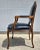 Outstanding carved frame arm chair with dark Blue leather upholstery with brass nail head trim. Produced by Chateau D'Ax...