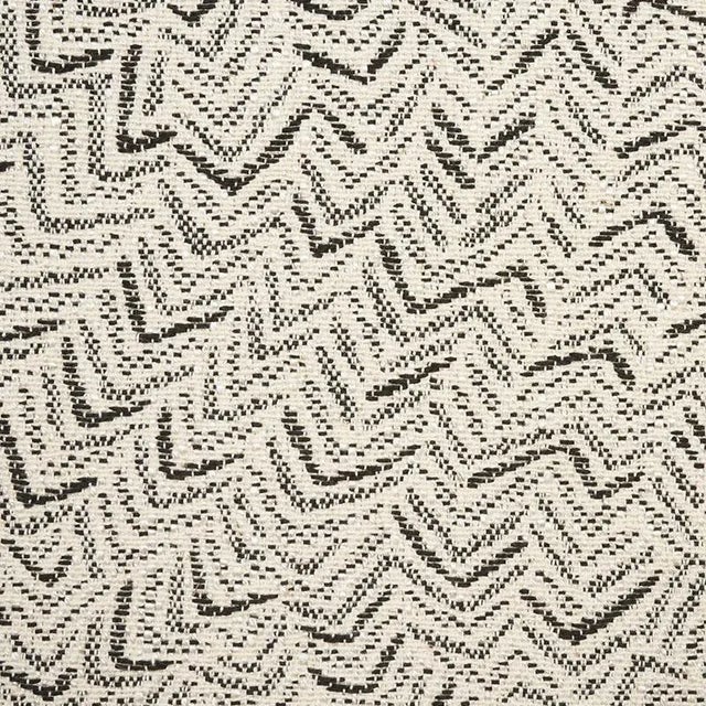 This small-scale, abstract jacquard weave features a multi-directional pattern that reads like a neutral, making it a...