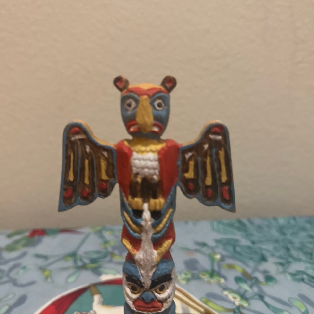 An eye-catching, vintage-inspired miniature totem pole crafted from durable molded plastic. This decorative piece features...