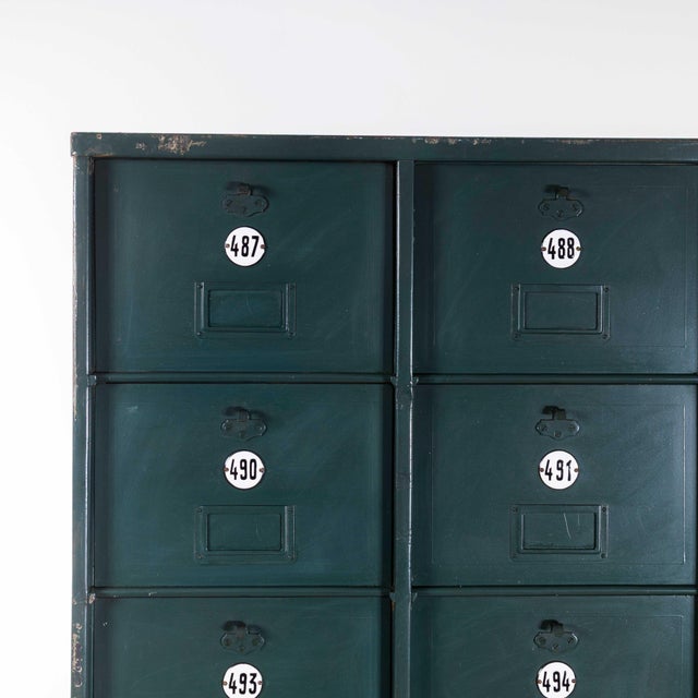 1920's french industrial metal cabinet dark green - twenty seven klappets. Beautifully made, very heavy-weight sheet metal...