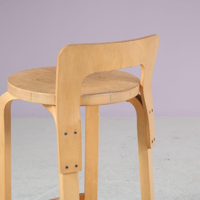 A beautiful and stool, model “k65”, designed by alvar aalto and manufactured by artek in finland around 1960. This is a...
