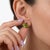 Elevate your collection with these vibrant three-stone peridot cluster earrings. This design features a prominent, pear-...