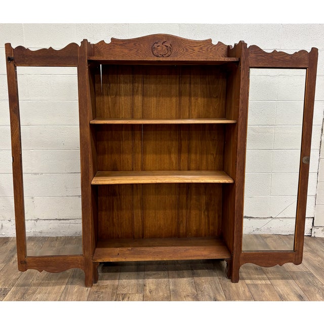 This is a stunning antique Victorian oak two door glass front locking bookcase cabinet, believed to be from the early...