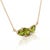 Bring a refreshing pop of color to your style with this botanical-inspired Peridot necklace. Three brilliant pear-cut...