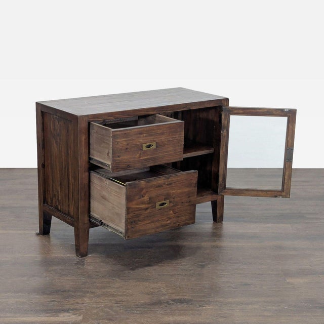 Made of pinewood reclaimed from old pallets with metal inset pulls in a rich antiqued brass finish. The credenza's offset...