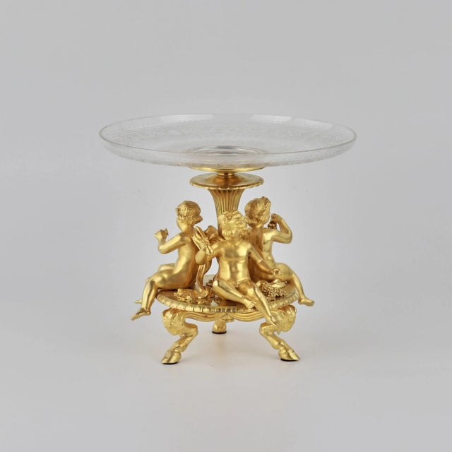 Delicate fruit vase of napoleon iii period, gilded bronze and crystal glass with decorative cutting. With three cupids...