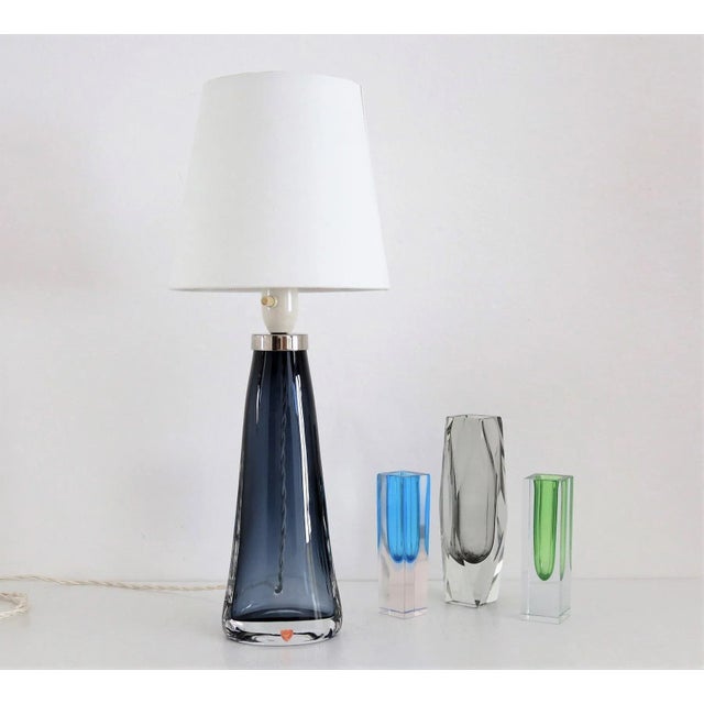 Beautiful table lamp made in Sweden during the 1960s, design Carl Fagerlund, produced by Orrefors. The stunning shiny blue...