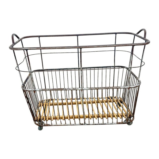 Authentic vintage French bakery cart made of metal with wooden slatted base and original industrial castors. Originally...