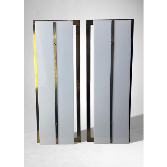 Stunning and highly decorative pair of large wall sconces in the style of Romeo Rega. The robust and substantial structure...