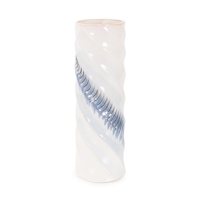 Featuring a smooth glossy white finish accented by a rhythmic wave of soft blue and subtle gold detailing, evoking rolling...