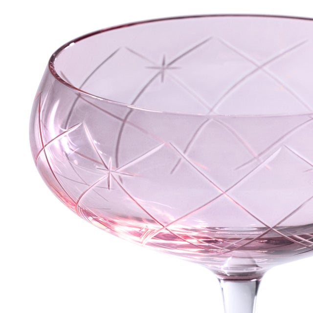 A stunning addition to any bar collection, this set of four coupe glasses features lustrous, hand-painted color cups with...