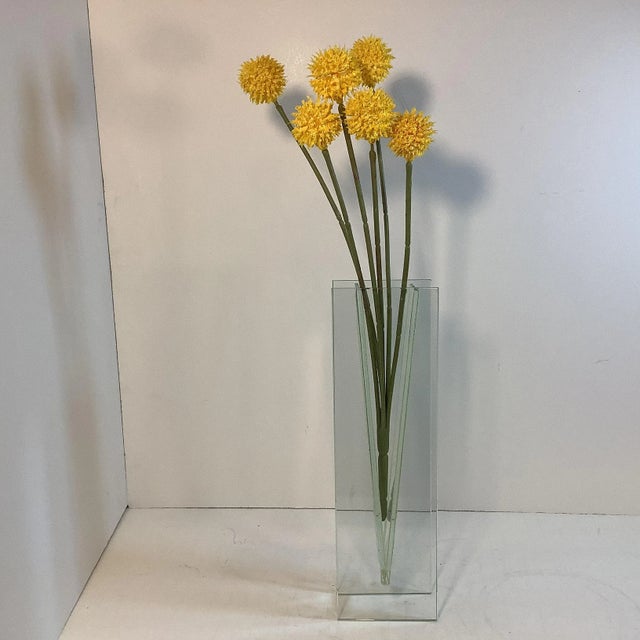 VINTAGE HOME is pleased to present a Contemporary Post Modern Bud Vase from the 1980s. This transparent glass vase is...