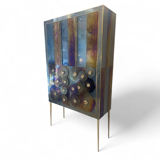 A striking piece crafted from Murano glass and glass paste, finished with gilt brass and lined with gray velvet. The...