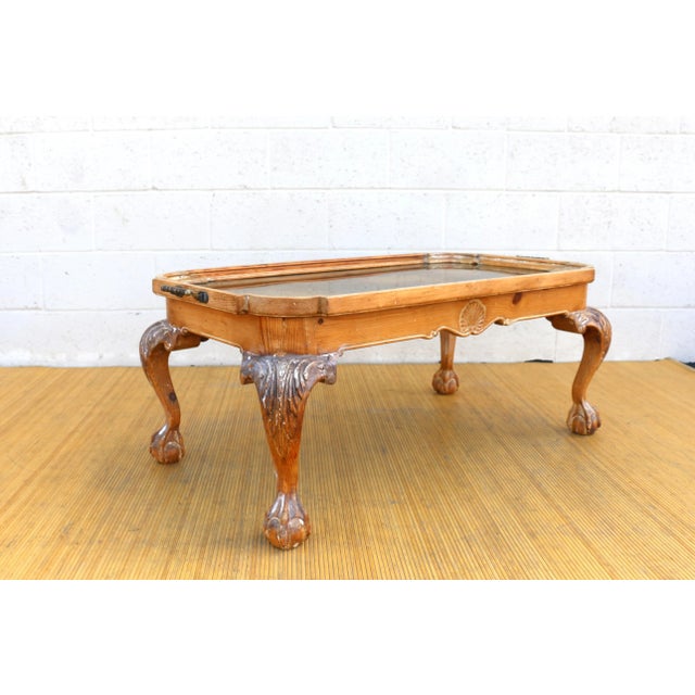 Wonderful chippendale coffee table made of solid pine wood and a brass tray with pine wood frame. It also has brass...