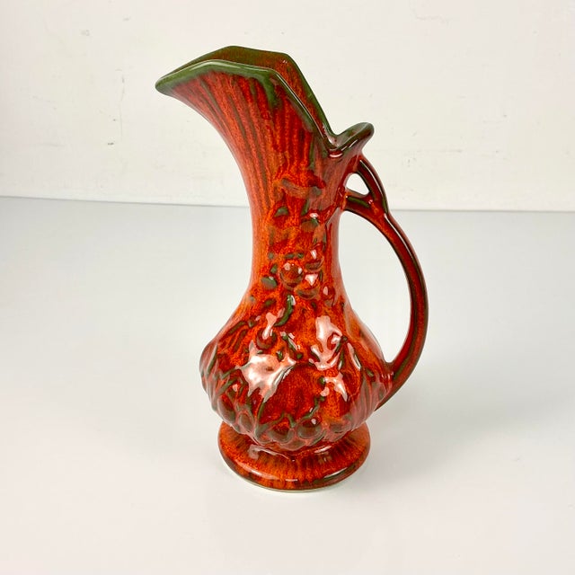 This is a lovely Drip Glazed Ceramic Vase Pitcher from USA Pottery. The ewer shape features a long neck that flares out to...