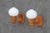 A charming pair of Swedish Modern wall sconces crafted in solid pine and fitted with nicely proportioned opaline glass...