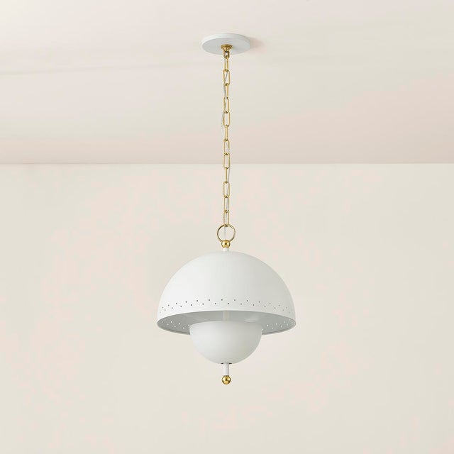 Influenced by midcentury design, Jojo features a dome-shaped shade with decorative perforations that allow light to...