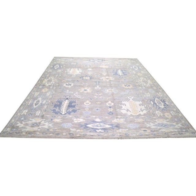 Hand-knotted with care using traditional rug-making techniques, this wool rug blends timeless craftsmanship with a modern...