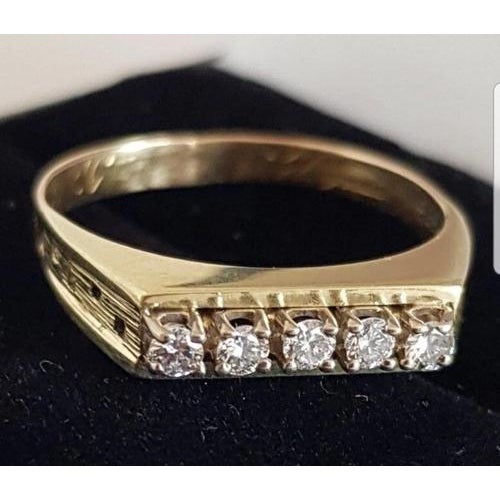 A refined modern british dress ring by h & t ltd, crafted in 14-carat yellow gold and claw-set with a brilliant-cut white...