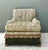 This exceptional vintage lounge chair is a masterclass in textural maximalism, blending organic inspiration with regency-...