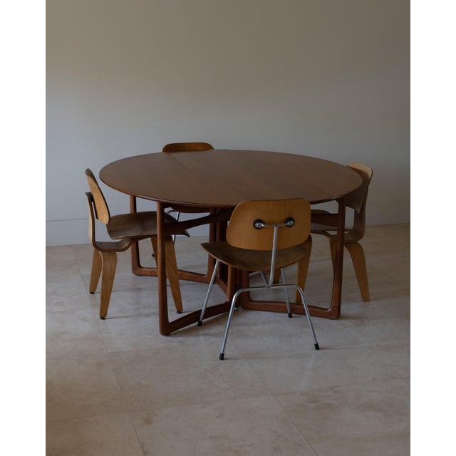 This beautiful 1960s Danish drop-leaf dining table, Model HM6, designed by Peter Hvidt and Orla Mølgaard-Nielsen, for...