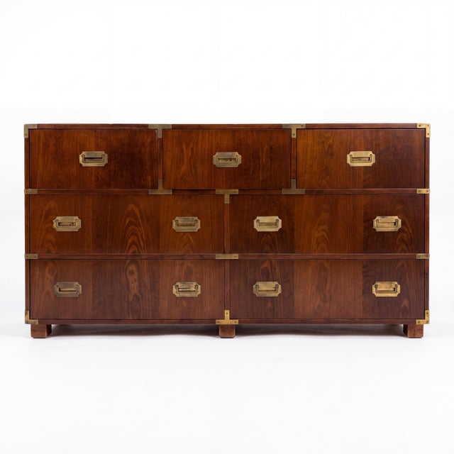 This is a 1970s campaign style walnut and brass chest by Baker Furniture Company. Known for their commitment to...