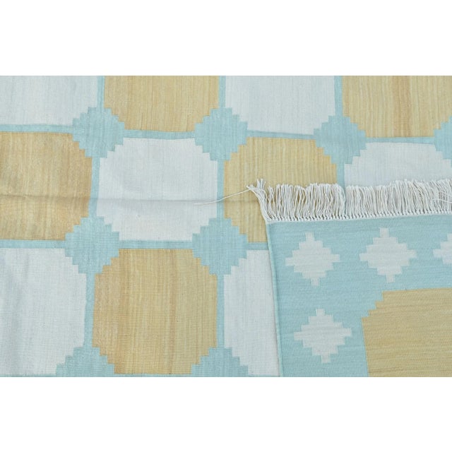 Our exclusive collection of colorfiul, haute bohemian rugs is made from naturally dyed 100% cotton yarn. These dhurrie...