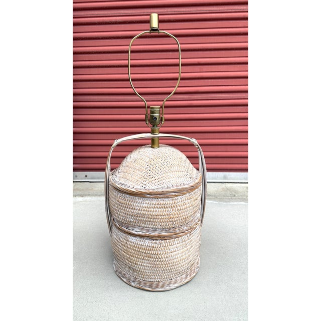 Vintage MCM Chinese wedding basket table lamp. Woven wicker/rattan body with a bamboo handle and structure. Perfect for a...