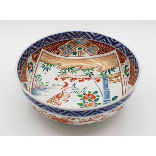 Circa 1880 Imari crane motif fruit bowl, Japan. The outside in trailing bittersweet & gilded vines below a diapered blue...