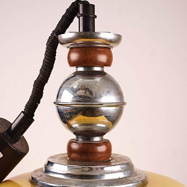 Vintage yellow glass chandelier with metal and wood frame Height: 70 Diameter: 32 document.a This piece is attributed to...