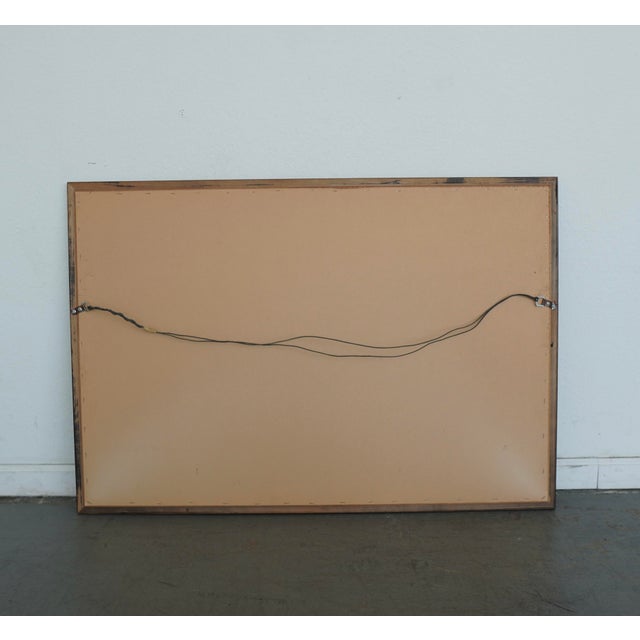 This vintage rectangular wall mirror features a substantial wood frame finished in a distressed black lacquer-style...