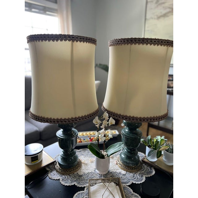 2 Vintage/antique-style table lamp With marble or faux marble green base, and bronze detailed bottom plate.