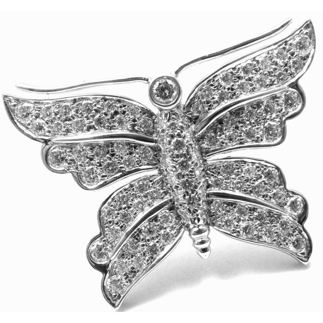 About This Piece: Metal: Platinum Measurements: 1" x 3/4" Weight: 8.4 grams Stones: round brilliant cut diamonds VS1...