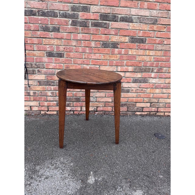This 18th Century English oak cricket table is wonderfully patinated and showcases the lovely grain found within the round...