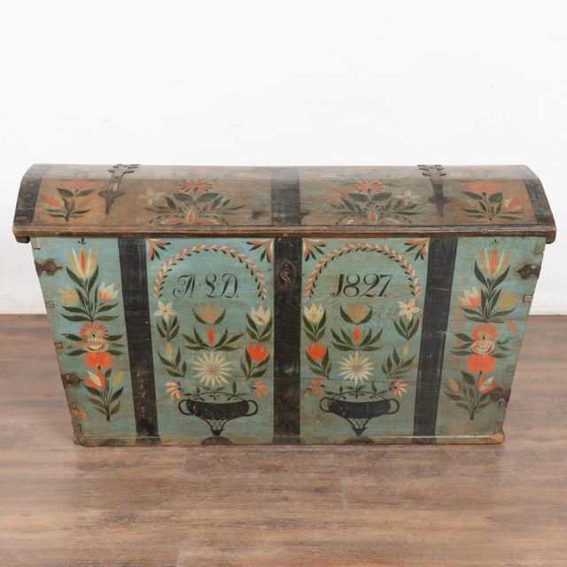 Original teal blue painted dome top oak trunk from Sweden with traditional hand-painted details include floral motif along...