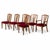 A handsome set of six vintage teak dining chairs, combining elegant mid-century styling with comfortable upholstered...