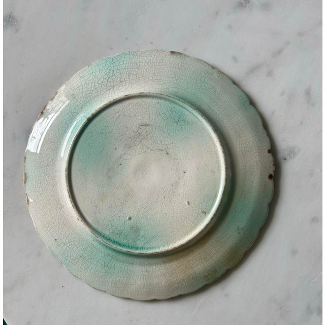 Delightful small plate with beautiful mottled tortoiseshell and green glaze. Striking piece! Pretty scalloped edges. No...