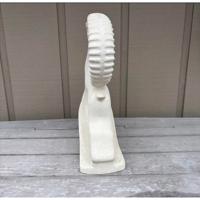 striking Haeger ceramic sculpture features a stylized leaping gazelle, a timeless motif of grace and movement that became...