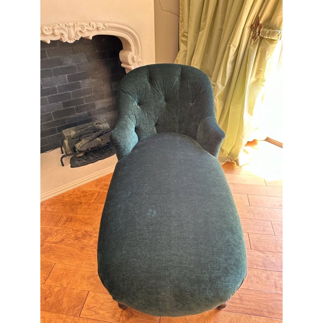 Comfortable, emarald green sofa bed for dreaming and reading. Unmarked.