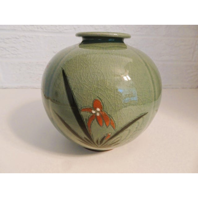 This is a Japanese vase with four cabbage leaf impression panels. Each panel has a raised hand painted floral design. Vase...