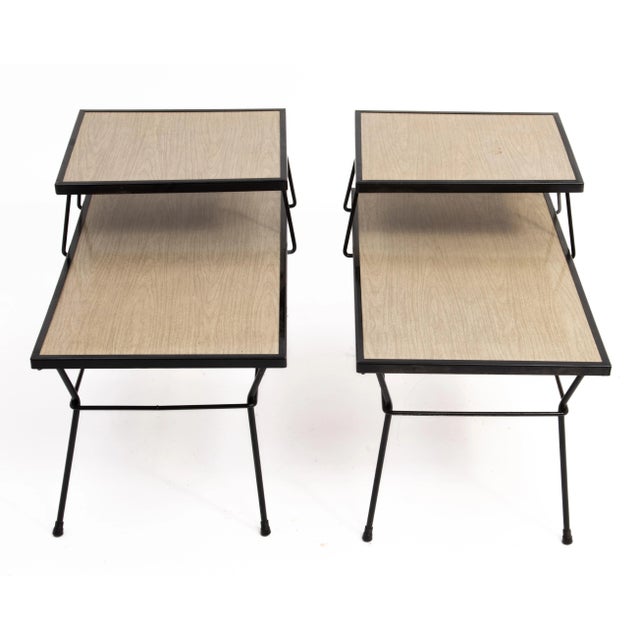 A pair of Mid Century iron framed step tables after the designs of George Nelson, Arthur Umanoff, Tony Paul and Paul...