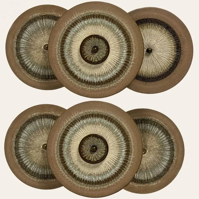 One of the Two spectacular circular ceramic wall lights, with beautiful accents. Manufactured in Denmark in the 1970s. A...