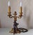 The candelabra features beautifully detailed scrolling arms, foliage, floral decoration and a decorative central finial....