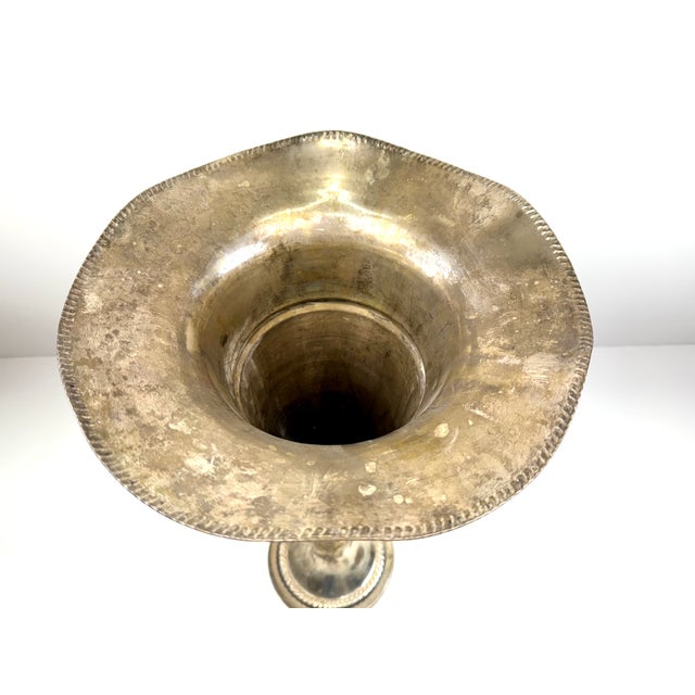 This stunning 23-inch silver-plated trumpet vase brings sophistication to any room with its gracefully fluted rim and fine...