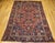 "A magnificent late 19th century Persian Heriz Serapi rug featuring a bold rust red field with striking corner spandrels...