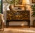 This antique trunk showcases exquisite hand-painted details on all sides, displaying remarkable craftsmanship. Preserved...