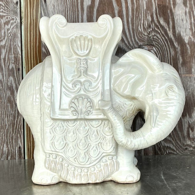 Introduce a touch of exotic boho elegance to your home with this charming vintage glazed ceramic elephant stool. Crafted...