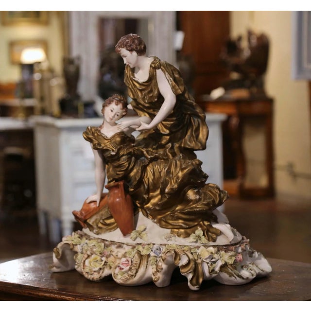 Bring romantic Italian elegance to a console, mantel, or center table with this large hand-painted porcelain figural group...